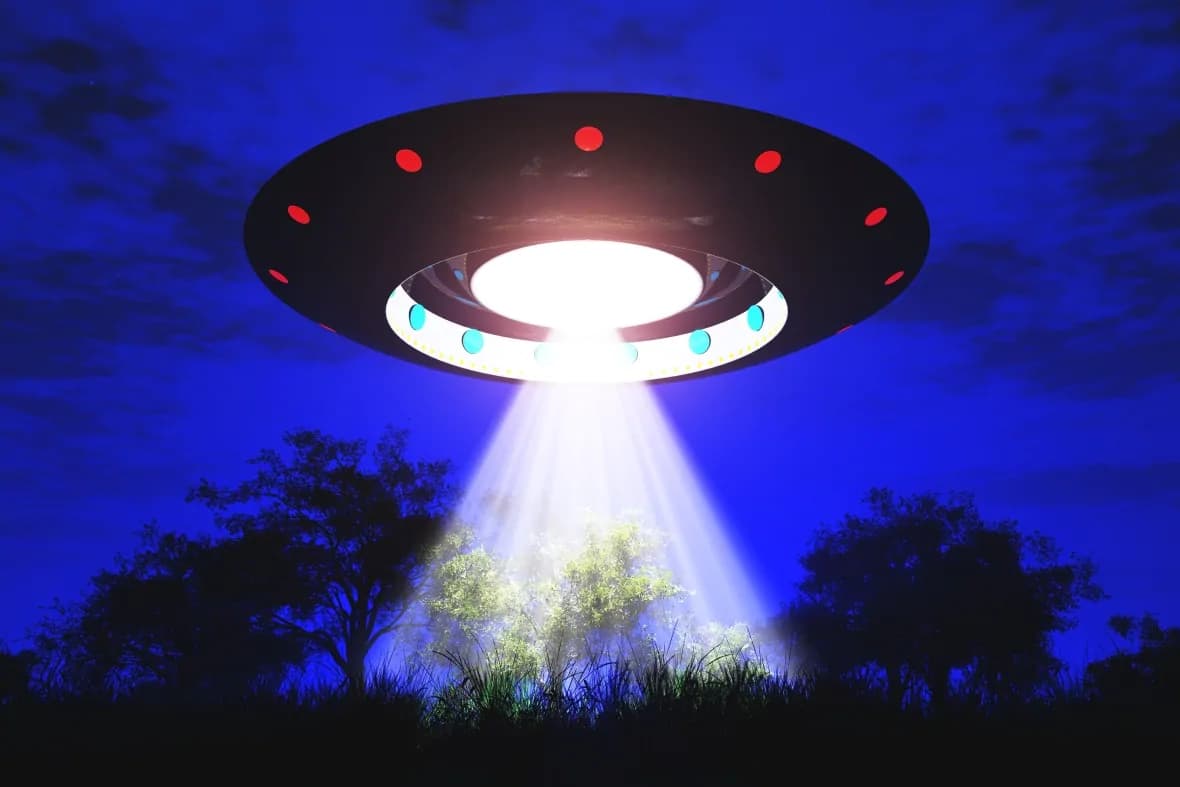 Flying saucer with light coming out of bottom